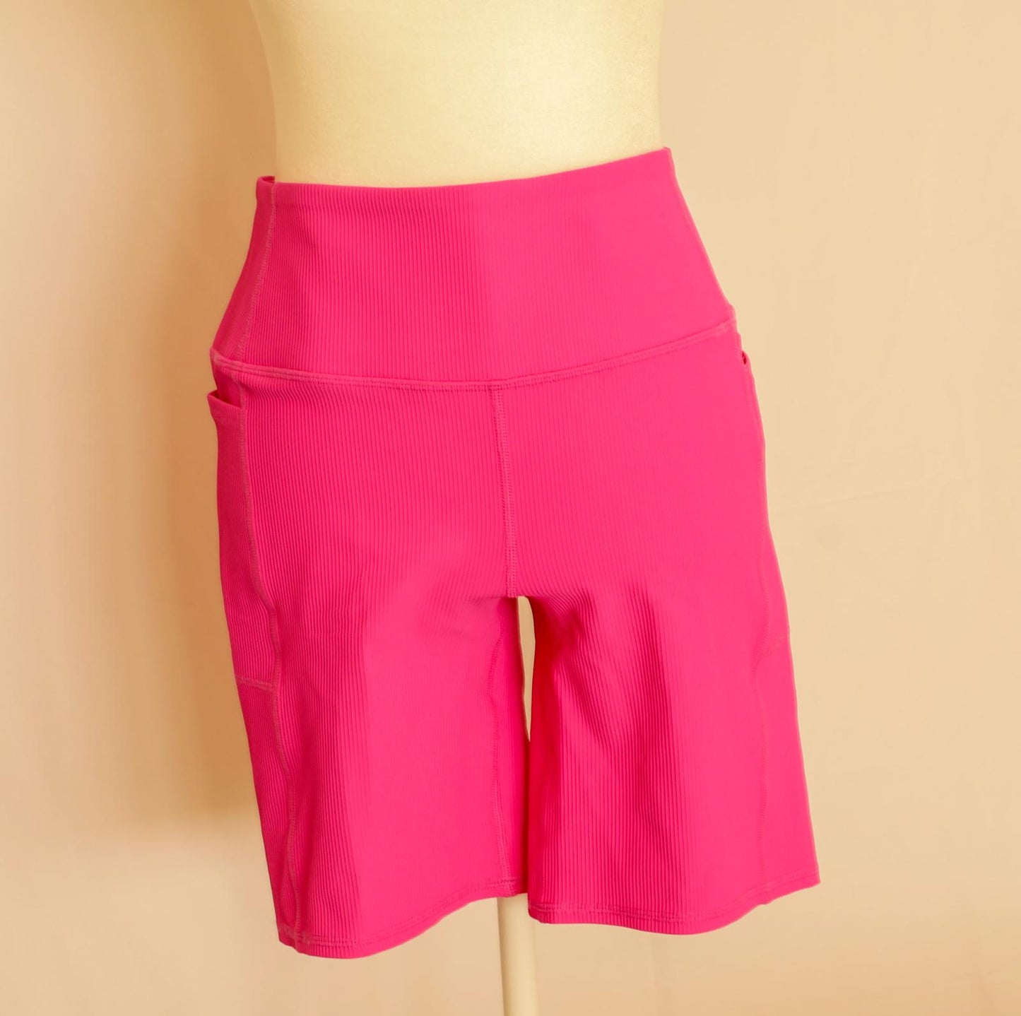 Licra corta de mujer rosada Sckechers