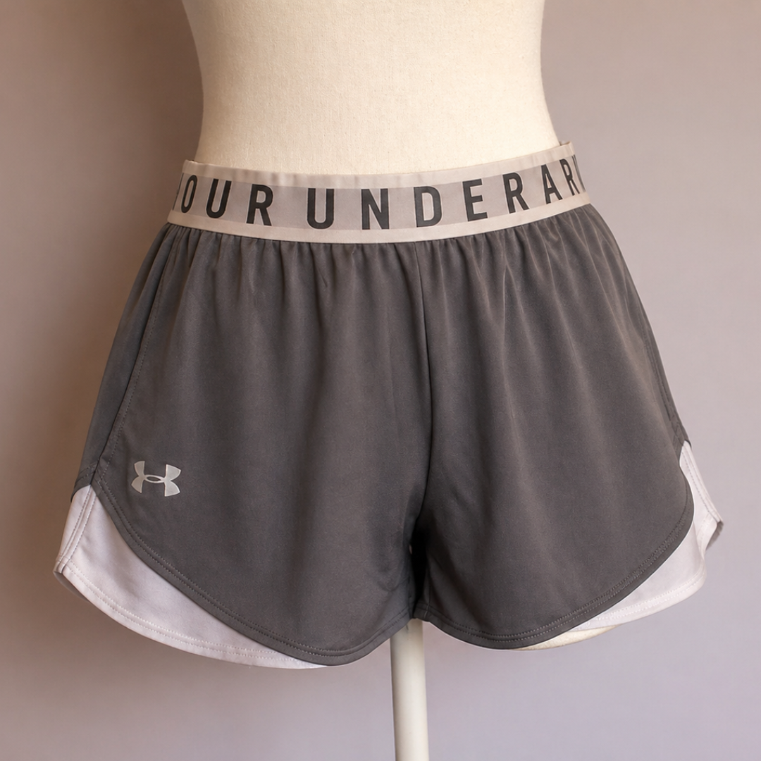 Pantaloneta gris con blanco Under Armour