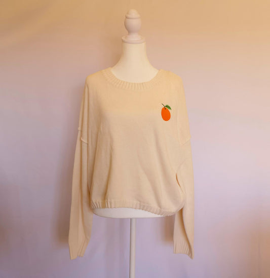 Suéter manga larga crema c/naranja